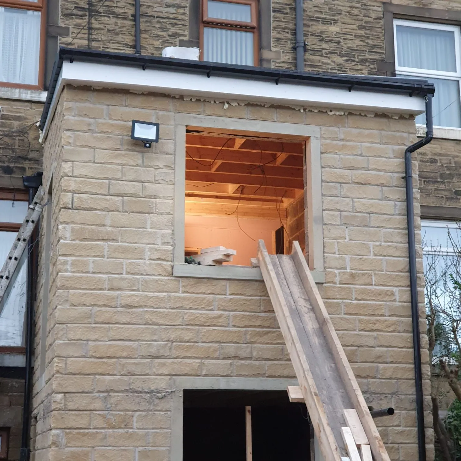 Stone-faced two-storey extension nearing completion, Sheffield