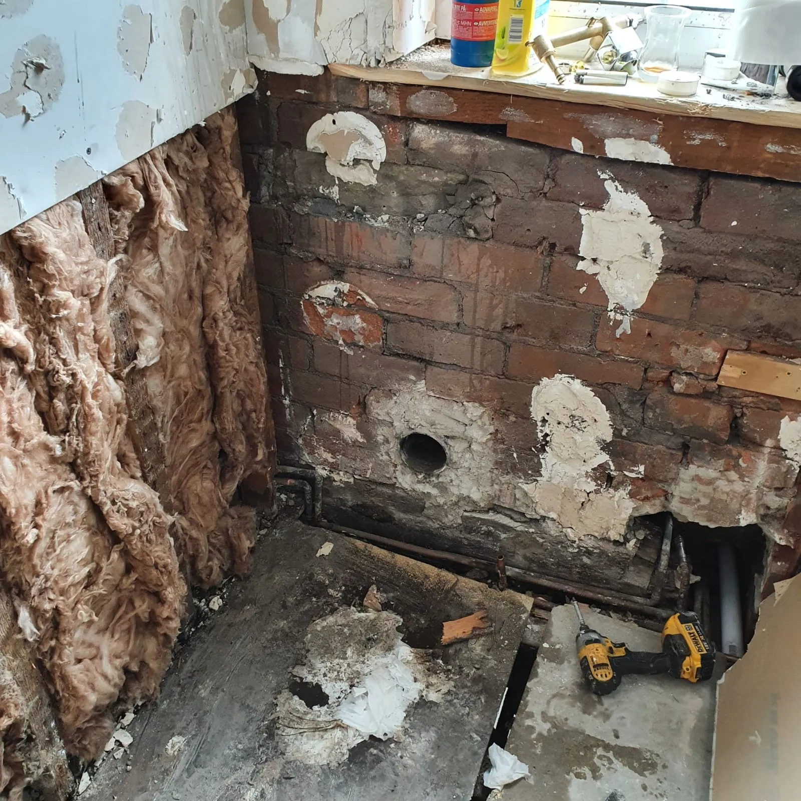 Bathroom walls stripped and damaged before the refit, Halifax