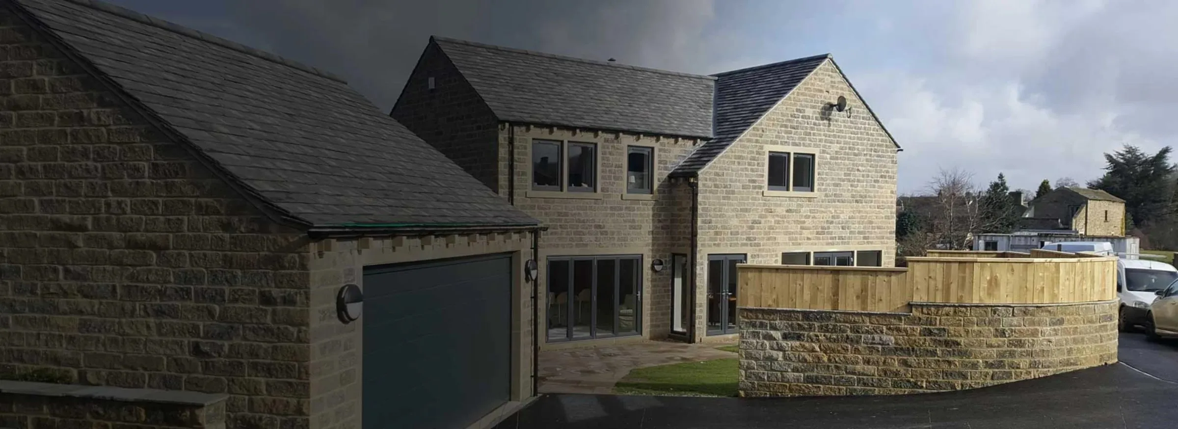 Stone-built detached new build with slate roof and double garage